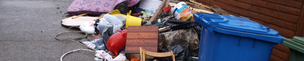 Fly tipping rubbish in a street